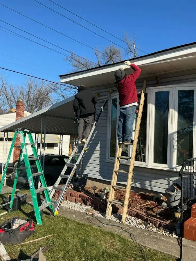 Restoration crew performing exterior repair in Clinton